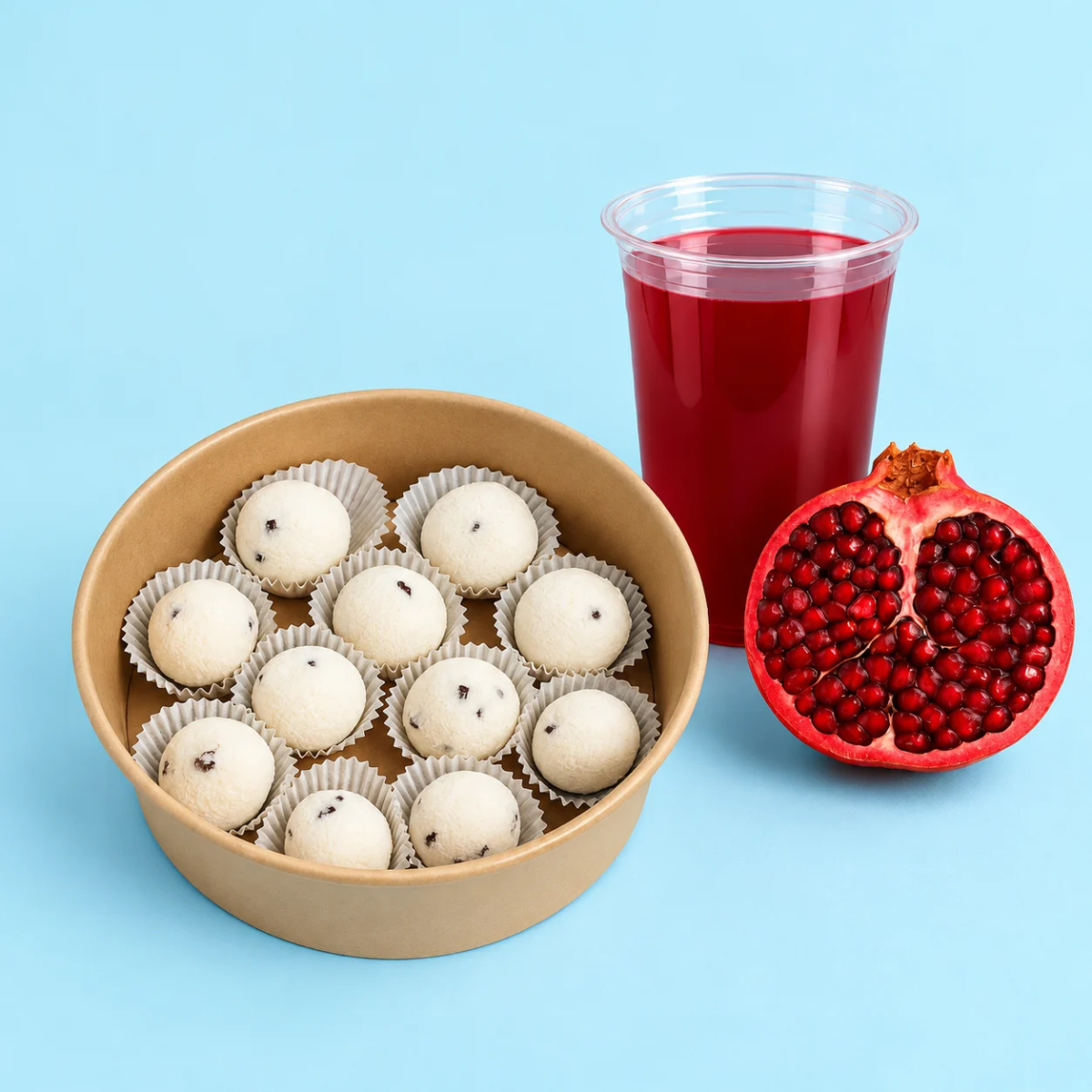 Palline di cocco e spremuta di melograno